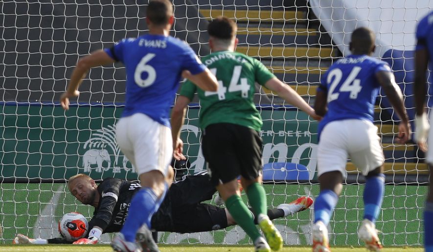 Leicester&#x27;s goalkeeper Kasper Schmeichel saves a penalty during the English Premier League soccer match between Leicester City and Brighton &amp;amp; Hove Albion at the King Power Stadium, in Leicester, England, Tuesday, June 23, 2020. (Darren Staples/Pool via AP)