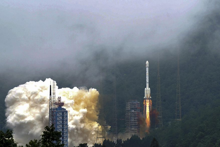 In this photo released by Xinhua News Agency, a rocket carrying a last satellite of the BeiDou Navigation Satellite System blasts off from the Xichang Satellite Launch Center in southwest China's Sichuan Province, Tuesday, June 23, 2020. (Xue Chen/Xinhua via AP) ** FILE **