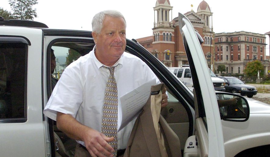 FILE - In this Sept. 23, 2011, file photo, former Judge Michael Conahan arrives at the federal courthouse in Scranton, Pa. Conahan, a former Pennsylvania judge involved in a scheme to send youths to a for-profit jail in exchange for kickbacks, has been released from federal prison with six years left on his sentence because of coronavirus concerns. Conahan, 68, was sent home from the low-security Federal Correctional Institution in Miami last Friday, June 19, 2020, on a 30-day furlough that could lead to permanent home confinement for the remainder of his sentence. (Mark Moran/The Citizens' Voice via AP, File)