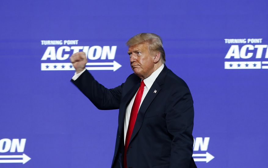 President Donald Trump gives a fist pump to the crowd after speaking at the Students for Trump conference at Dream City Church, Tuesday, June 23, 2020, in Phoenix. (AP Photo/Ross D. Franklin)