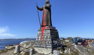 The vandalised statue of noted coloniser Hans Egede in Nuuk, Greenland, Sunday June 21, 2020, daubed with red paint early Sunday morning. Hans Egede was a Dano-Norwegian Lutheran missionary who launched mission efforts to Greenland. (Christian Klindt Soelbeck/Ritzau Scanpix via AP)