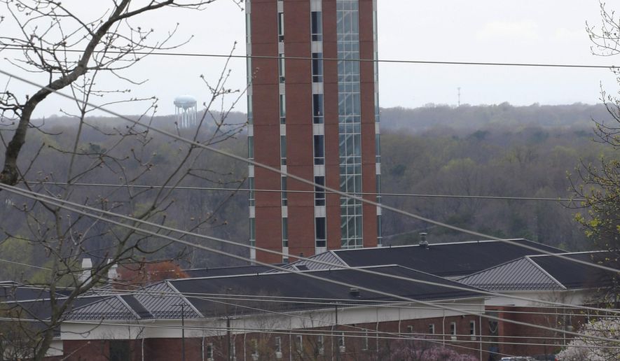 FILE - This is a March 24, 2020, file photo showing Liberty University's Freedom Tower in Lynchburg, Va. Three football players at Liberty University say they have entered the transfer portal, with two of them citing “racial insensitivity” by the university's leadership or similar reasons for their decisions. (AP Photo/Steve Helber, File)
