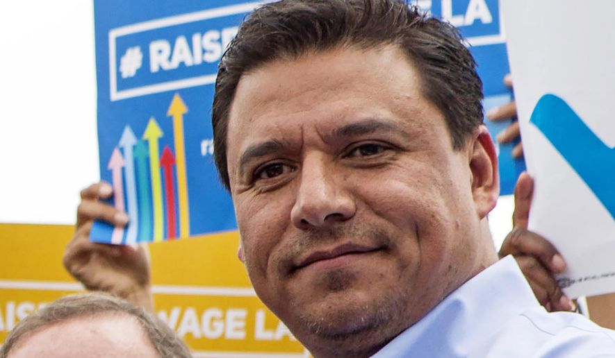 In this June 13, 2015, file photo Los Angeles City Councilman Jose Huizar is seen at the signing of a minimum-wage ordinance at Martin Luther King Jr. Park in Los Angeles. Huizar, who has been under the cloud of a federal corruption investigation, was arrested Tuesday, June 23, 2020, the FBI said. Councilman Huizar was taken into custody without incident at his Boyle Heights home, said FBI spokeswoman Laura Eimiller. The mayor and other city leaders have been calling for Huizar to resign since his former special assistant agreed to plead guilty in a $1 million bribery scheme involving real estate developers. (AP Photo/Ringo H.W. Chiu, File)