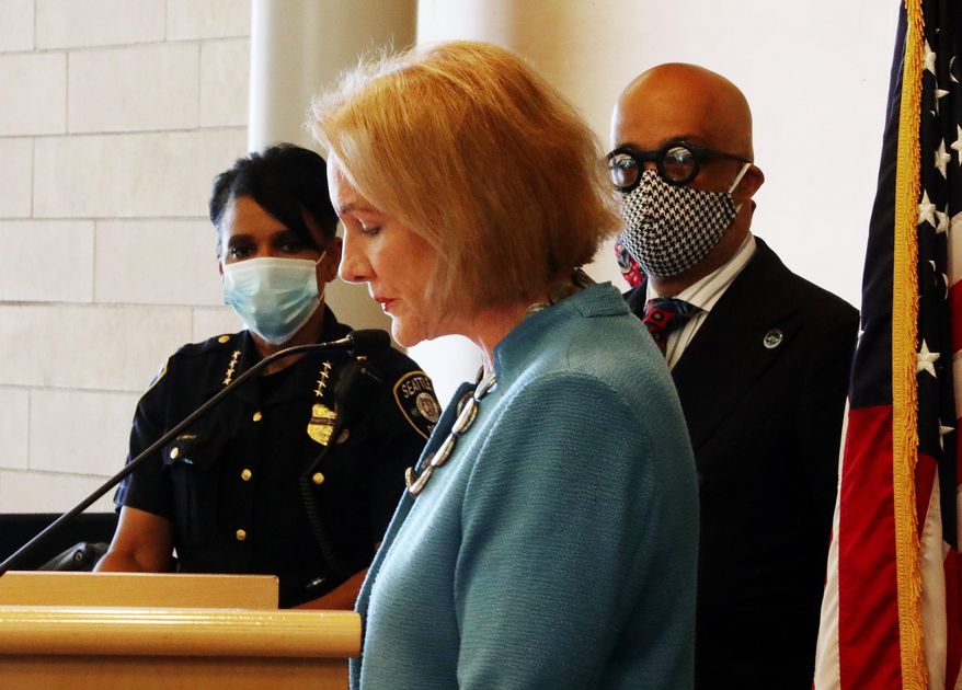 Seattle Mayor Jenny Durkan, center, pauses while speaking, as Chief of Police Carmen Best, left, listens during a news conference Monday, June 22, 2020, in Seattle. Durkan said the city is working with the community to bring the “Capitol Hill Occupied Protest” zone to an end. (Ken Lambert/The Seattle Times via AP)