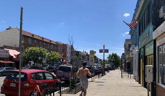 The District&#x27;s 18th Street NW in Adams Morgan will become a pedestrian plaza on Friday afternoon, June 26, 2020, as the city shuts down the area to vehicles to create a space for outdoor dining and social distancing. (Sophie Kaplan / The Washington Times)