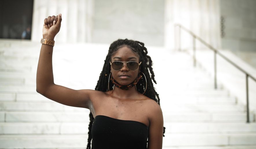Aalayah Eastmond, a Parkland, Fla. activist, poses for a portrait after leading the crowd in chants at the Lincoln Memorial in Washington on Wednesday, June 10, 2020, during protests over the death of George Floyd, a Black man who died after being restrained by Minneapolis police officers on May 25. “As a young Black girl that survived a mass shooting at an affluent high school that was predominantly white, it played a huge role in my activism,” said the 19-year-old, who just finished her freshman year at Trinity Washington University. (AP Photo/Maya Alleruzzo)