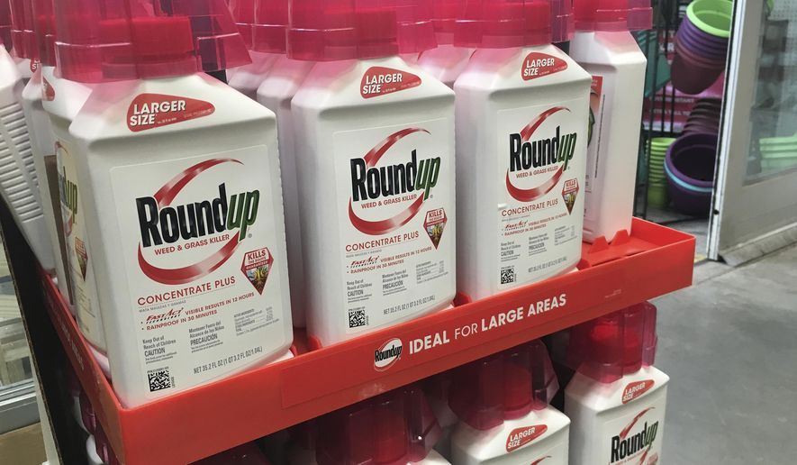 In this, Feb. 24, 2019, file photo, containers of Roundup are displayed at a store in San Francisco. German pharmaceutical company Bayer announced Wednesday, June 24, 2020, it’s paying up to $10.9 billion to settle a lawsuit over subsidiary Monsanto’s weedkiller Roundup, which has faced numerous lawsuits over claims it causes cancer.  (AP Photo/Haven Daley, File)