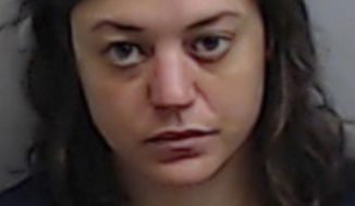 This booking photo released by the Fulton County, Ga., Jail shows Natalie White, who was charged Tuesday, June 23, 2020, with first degree arson in the burning of an Atlanta Wendy&#39;s in the wake of the Rayshard Brooks shooting. (Fulton County Jail via AP)