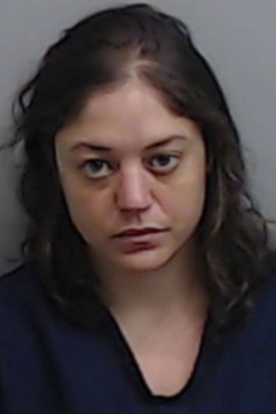This booking photo released by the Fulton County, Ga., Jail shows Natalie White, who was charged Tuesday, June 23, 2020, with first degree arson in the burning of an Atlanta Wendy's in the wake of the Rayshard Brooks shooting. (Fulton County Jail via AP)