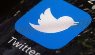 FILE - This April 26, 2017, file photo shows the Twitter app icon on a mobile phone in Philadelphia.  A conservative social media user whose memes have been repeatedly reposted by President Donald Trump has been kicked off Twitter for repeated copyright violations. Logan Cook, who posts under the name Carpe Donktum, was permanently suspended Tuesday, June 23, 2020. The move came days after Trump retweeted a Cook video that contained doctored CNN footage.  (AP Photo/Matt Rourke, File)