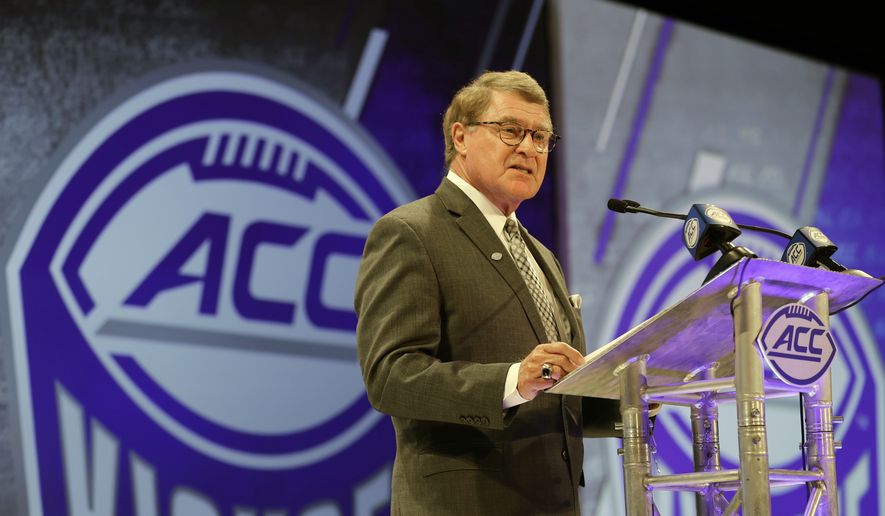 In this July 18, 2018, file photo, Atlantic Coast Conference commissioner John Swofford speaks during a news conference at the ACC NCAA college football media day in Charlotte, N.C. Atlantic Coast Conference Commissioner John Swofford is retiring after the 2020-21 academic year, ending his tenure after 24 years. Swofford, 71, has been commissioner of the ACC since 1997, the longest run in that position in the history of the 67-year-old conference. (AP Photo/Chuck Burton, File) **FILE**