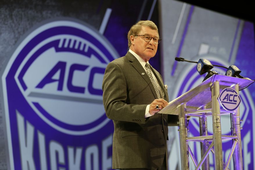 In this July 18, 2018, file photo, Atlantic Coast Conference commissioner John Swofford speaks during a news conference at the ACC NCAA college football media day in Charlotte, N.C. Atlantic Coast Conference Commissioner John Swofford is retiring after the 2020-21 academic year, ending his tenure after 24 years. Swofford, 71, has been commissioner of the ACC since 1997, the longest run in that position in the history of the 67-year-old conference. (AP Photo/Chuck Burton, File) **FILE**