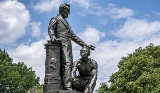 The Emancipation Memorial in Washington&#39;s Lincoln Park depicts a freed slave kneeling at the feet of President Abraham Lincoln, Thursday, June 25, 2020. Calls are intensifying for the removal of the statue as the nation confronts racial injustice. (AP Photo/J. Scott Applewhite)