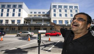 FILE - In this Oct. 23, 2019 file photo, developer Danny Gaekwad talks about the roof top bar on his Hilton Garden Inn hotel that is presently under construction  in Ocala, Fla.  Since the coronavirus crisis started, hotel owners say they are struggling to get relief on a type of loan that Wall Street investors buy.  [Doug Engle/Ocala Star-Banner via AP)