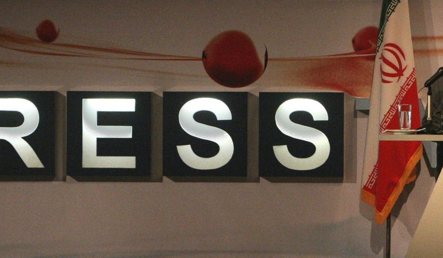FILE—In this July 2, 2007, file photo, the then President Mahmoud Ahmadinejad delivers his speech during inauguration ceremony for Iran's first English-language channel, Press TV, as its logo is seen in background, in Tehran, Iran. (AP Photo/Vahid Salemi, File)