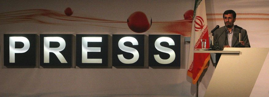 FILE—In this July 2, 2007, file photo, the then President Mahmoud Ahmadinejad delivers his speech during inauguration ceremony for Iran's first English-language channel, Press TV, as its logo is seen in background, in Tehran, Iran. (AP Photo/Vahid Salemi, File)