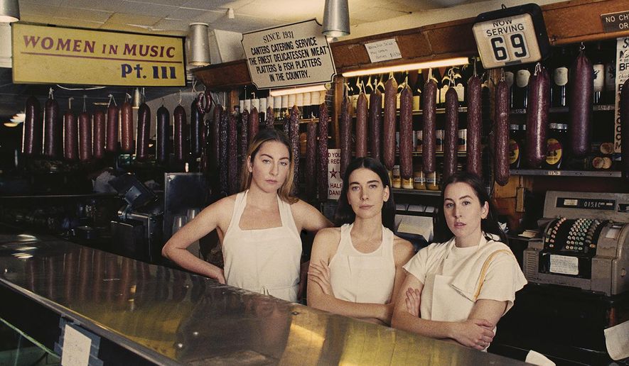 This cover image released by Columbia Records shows "Women in Music, Pt. III," the latest release by Haim. (Columbia Records via AP)