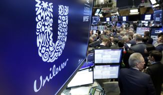 FILE - In this Thursday, March 15, 2018 file photo, the logo for Unilever appears above a trading post on the floor of the New York Stock Exchange. Consumer products giant Unilever said Thursday, June 25, 2020, it is aiming for a “more inclusive vision of beauty” and will remove words such as “fair,” “whitening” and “lightening” from its products, a move that comes amid intense global debate about race sparked by the Black Lives Matter movement. (AP Photo/Richard Drew, file)
