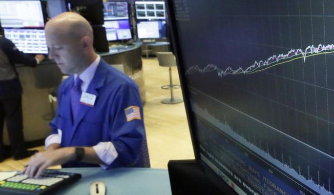In this Aug. 22, 2018, file photo a chart on a screen on the floor of the New York Stock Exchange shows the rise of the S&amp;amp;P 500 index since 2009. (AP Photo/Richard Drew, File)