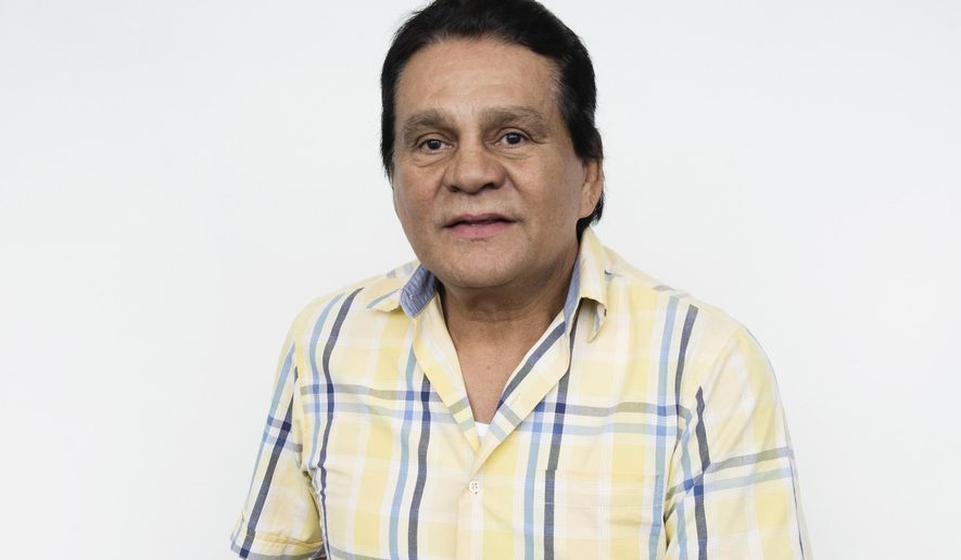 This Aug. 4, 2016 photo shows boxer Roberto Durán posing for a portrait in New York, to promote the film, "Hands of Stone." The film, about Duran and boxing trainer Ray Arcel, opens on Aug. 26. Durán, who held world championships in four weight classes during his more than three-decade career, has tested positive for the coronavirus but has had only mild symptoms so far, one of his sons said Thursday, June 25, 2020. (Photo by Taylor Jewell/Invision/AP, File)