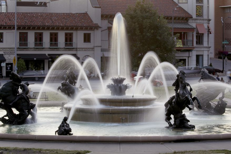 In this photo taken Tuesday, June 23, 2020, the J.C. Nichols fountain is seen in Kansas City, Mo. The city's board of parks and recreation is considering a proposal to remove the J.C. Nichols name from the fountain and a nearby street as they address racial concerns about the influential local developer. Nichols developed some of the area's most desirable neighborhoods as well as the city's County Club Plaza shopping district in the early 1900's but excluded Blacks, Jews and other minorities using deed restrictions on his properties. (AP Photo/Charlie Riedel)