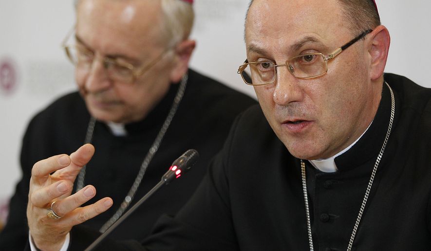FILE -- In this file photo taken on March 14, 2019, Archbishop Wojciech Polak, right, the Roman Catholic primate of Poland, addresses the media during a news conference at the episcopate building in Warsaw. Pope Francis has named a temporary administrator to lead a southern Polish diocese where the bishop has been accused of covering up cases of sexual abuse that were featured in a second abuse documentary that has rocked Poland&#39;s Catholic Church. (AP Photo/Czarek Sokolowski)