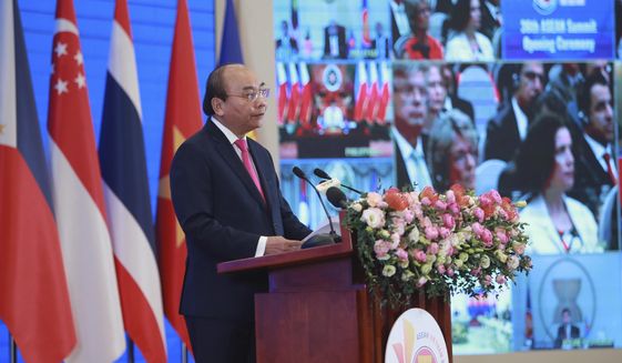 Vietnamese Prime Minister Nguyen Xuan Phuc delivers a speech at the opening ceremony of the 36th ASEAN Summit in Hanoi, Vietnam Friday, June 26, 2020. Leaders from the Southeast Asian ten-nation bloc hold the bi-annual summit via online video conference to discuss regional issues. (AP Photo/Hau Dinh)