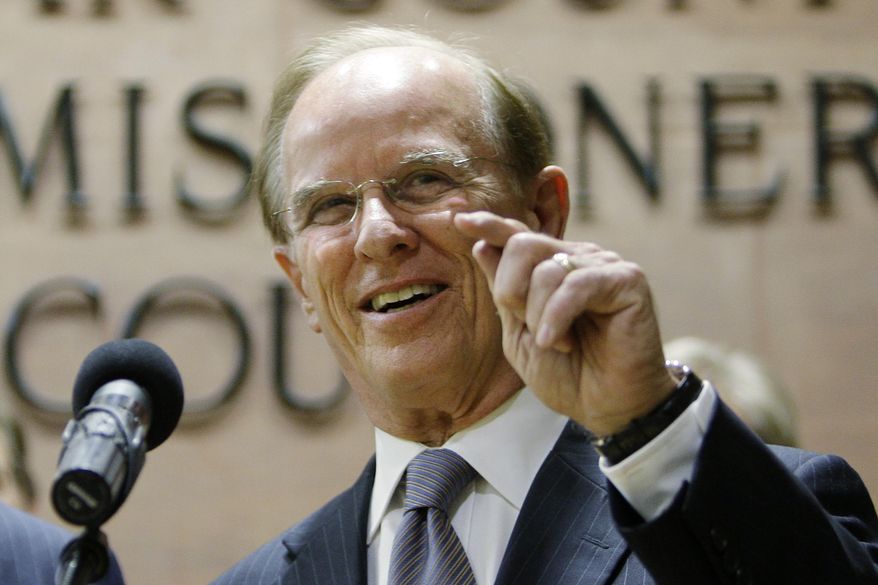 In this April 22, 2009 file photo, Bexar County Judge Nelson W. Wolff, takes part in a news conference in San Antonio. Bexar, a prominent Texas judge says an irate man smacked his hand when he tried to persuade the man to don a face covering Wednesday, June 24, 2020, in San Antonio. A spokeswoman for Wolff, the county's top non-judicial official, said the man was berating a store cashier who was asking him to wear a mask, when Wolff intervened. Wolff had ordered businesses to require face coverings as an anti-coronavirus measure and was explaining the need for them to the man. (AP Photo/Eric Gay File) **FILE**