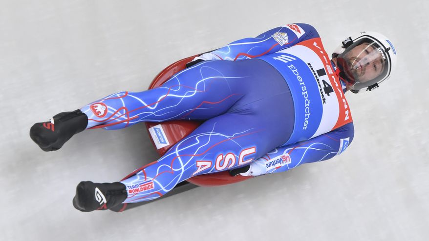 FILE - In this Nov. 24, 2019, file photo, United States's Chris Mazdzer speeds down the course during his first run at the men's luge World Cup race in Igls, Austria. The International Luge Federation is still planning for a full 10-race international season this fall and winter, though has yet to say what protocols will be added to deal with the coronavirus. “I really think it’s going to come down to just creating a safe environment, having people be comfortable and taking the right safety precautions,” said Olympic silver medalist Chris Mazdzer, the longtime USA Luge slider and the athletes’ representative on the FIL Executive Board. (AP Photo/Kerstin Joensson, File)