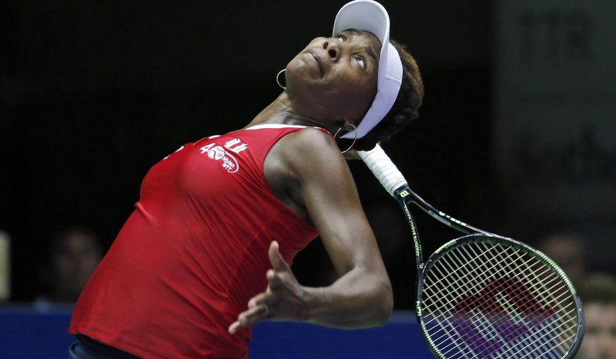 FILE - In this July 14, 2015, file photo, Washington Kastles' Venus Williams serves to Austin Aces' Nicole Gibbs during a tennis match in Washington. World TeamTennis says Venus Williams has committed to play in its three-week season that starts July 12, 2020. Williams will be a member of the Washington Kastles. That is one of nine teams that will gather at a resort in West Virginia. (AP Photo/Alex Brandon, File)