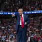 In this June 20, 2020, photo, President Donald Trump arrives on stage to speak at a campaign rally at the BOK Center in Tulsa, Okla. President Donald Trump is sharpening his focus on his ardent base of supporters as polls show a diminished standing for the president in battleground states that will decide the 2020 election (AP Photo/Evan Vucci) ** FILE **