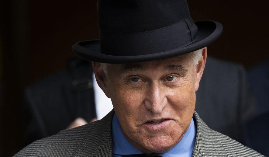 In this Nov. 12, 2019, file photo Roger Stone leaves federal court in Washington. A federal judge is giving Stone, a longtime ally and confidant of President Donald Trump, an additional two weeks before he must report to serve his federal prison sentence. (AP Photo/Manuel Balce Ceneta, File)