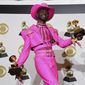 In this Jan. 26, 2020, photo, Lil Nas X poses in the press room with the awards for best music video and best pop duo/group performance for &amp;quot;Old Town Road,&amp;quot; at the 62nd annual Grammy Awards in Los Angeles. (AP Photo/Chris Pizzello) **FILE**