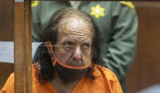 Adult film star Ron Jeremy appears for his arraignment on rape and sexual assault charges at Clara Shortridge Foltz Criminal Justice Center, Friday, June 26, 2020, in Los Angeles. Jeremy pleaded not guilty to charges of raping three women and sexually assaulting a fourth. (David McNew/Pool Photo via AP)