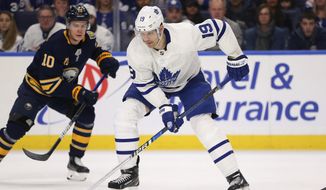  In this  Sunday, Feb. 16, 2020 file photo, Toronto Maple Leafs forward Jason Spezza (19) controls the puck during the second period of the team&#39;s NHL hockey game against the Buffalo Sabres in Buffalo, N.Y. Jason Spezza&#39;s confidence in the NHL returning wasn&#39;t shaken by word of 11 players testing positive for the coronavirus. Given his involvement in Players&#39; Association talks, the veteran Toronto forward knew from doctors&#39; input that there would be positive test results in hockey just as there have been in other sports as group workouts ramp up across North America.(AP Photo/Jeffrey T. Barnes, File)  **FILE**