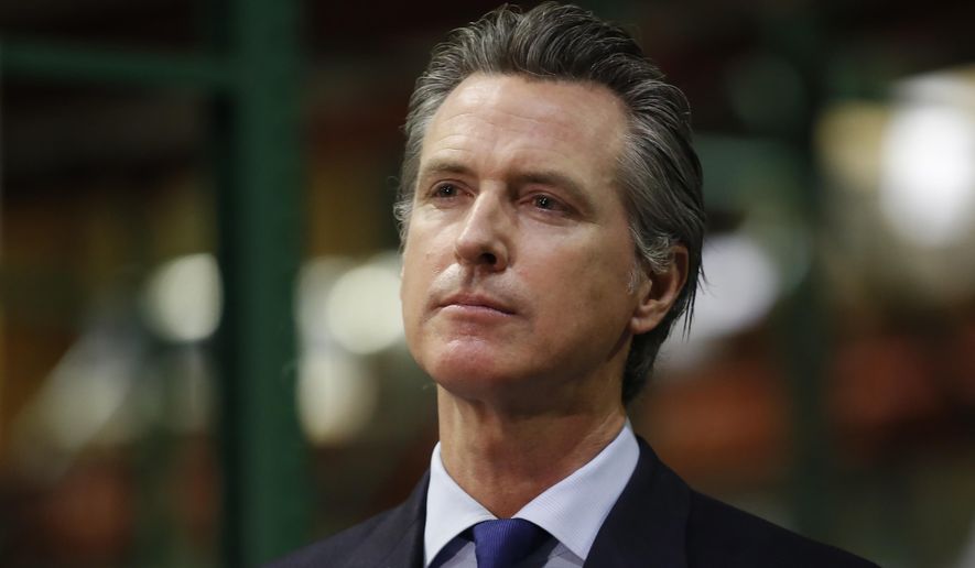 Gov. Gavin Newsom listens to a reporter's question as he gives an update on the state's response to the coronavirus pandemic, during a news conference in Rancho Cordova, Calif., Friday, June 26, 2020. Newsom said he wants Imperial County in Southern California to reimpose a stay-at-home order amid a surge in positive coronavirus tests. (AP Photo/Rich Pedroncelli, Pool)