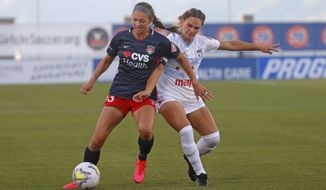 Chicago Red Stars&#39; Bianca St. Georges, right, battles with Washington Spirit forward Ashley Hatch (33) during the first half of an NWSL Challenge Cup soccer match at Zions Bank Stadium, Saturday, June 27, 2020, in Herriman, Utah. (AP Photo/Rick Bowmer) ** FILE **