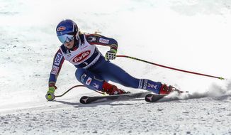 FILE - In this Nov. 15, 2017, file photo, Mikaela Shiffrin gets low in her turn during a downhill training run at Copper Mountain, Colo. Shiffrin and the U.S. women&#39;s ski team, along with the men&#39;s Europa squad, returned to snow for a June camp in Copper Mountain, Colorado. It was a chance to go fast on the slopes again after the season abruptly ended in March due to the coronavirus pandemic. (Chris Dillmann/Vail Daily via AP, File)