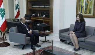 In this photo released on Thursday, June 11, 2020 by the Lebanese Government, President Michel Aoun, left, meets with U.S. Ambassador to Lebanon Dorothy Shea, at the Presidential Palace in Baabda, east of Beirut, Lebanon. A Lebanese court issued a ruling Saturday barring local and foreign media in the country from interviewing the U.S. ambassador to Beirut for a year, calling a recent interview in which she criticized the powerful Hezbollah group seditious and a threat to social peace. (Dalati Nohra/Lebanese Government via AP)