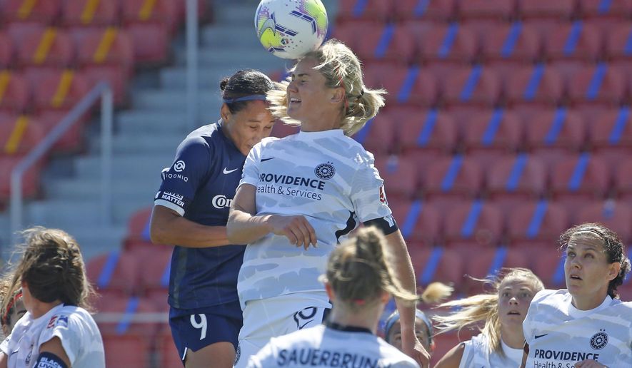 North Carolina Courage forward Lynn Williams (9) and Portland Thorns FC midfielder Lindsey Horan (10) battle for the ball during the first half of an NWSL Challenge Cup soccer match at Zions Bank Stadium, Saturday, June 27, 2020, in Herriman, Utah. (AP Photo/Rick Bowmer)
