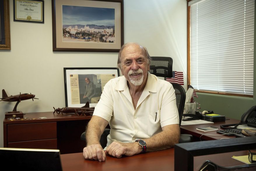 In this Tuesday, June 23, 2020, photo, Mesquite Mayor Al Litman poses for a photo at his office in Mesquite, Nev. Litman has personally been providing almost daily updates with online briefings to the 20,000 local residents of the town 80 miles northeast of Las Vegas, related to the COVID-19 pandemic (Christopher DeVargas/Las Vegas Sun via AP)