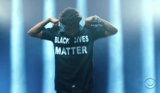 In this video grab issued Sunday, June 28, 2020, by BET, Roddy Ricch wears a shirt that says Black Lives Matter while performing during the BET Awards. (BET via AP)