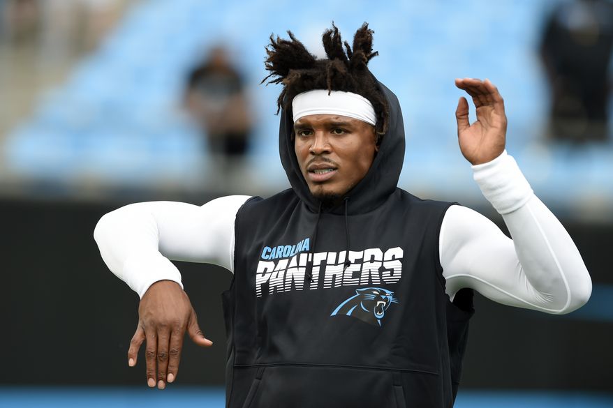 In this Sept. 12, 2019, file photo, Carolina Panthers quarterback Cam Newton warms up prior to the team's NFL football game against the Tampa Bay Buccaneers in Charlotte, N.C. The New England Patriots have reached an agreement with free-agent quarterback Newton, bringing in the 2015 NFL Most Valuable Player to help the team move on from three-time MVP Tom Brady, a person with knowledge of the deal told The Associated Press. (AP Photo/Mike McCarn) ** FILE **
