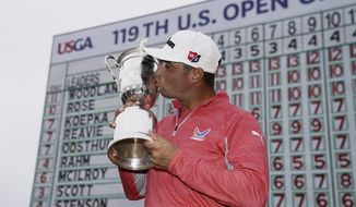 FILE - In this June 16, 2019, file photo, Gary Woodland poses with the trophy after winning the U.S. Open golf tournament in Pebble Beach, Calif. The U.S. Open is returning to NBC starting this year at Winged Foot after Fox Sports has asked to end its 12-year contract with the USGA, multiple people told The Associated Press on Sunday night, June 28, 2020. (AP Photo/Carolyn Kaster, File)