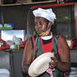 In this photo taken Saturday, June 20, 2020, Rebecca Nakamanya works at a restaurant near a bus terminal in capital Kampala, Uganda. The COVID-19 pandemic means that millions of women in Africa and other developing regions could lose years of success in contributing to household incomes, asserting their independence and expanding financial inclusion. (AP Photo/Ronald Kabuubi)