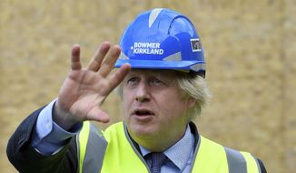Britain&#39;s Prime Minister Boris Johnson visits the construction site of Ealing Fields High School in west London, Monday June 29, 2020. (Toby Melville/Pool via AP)