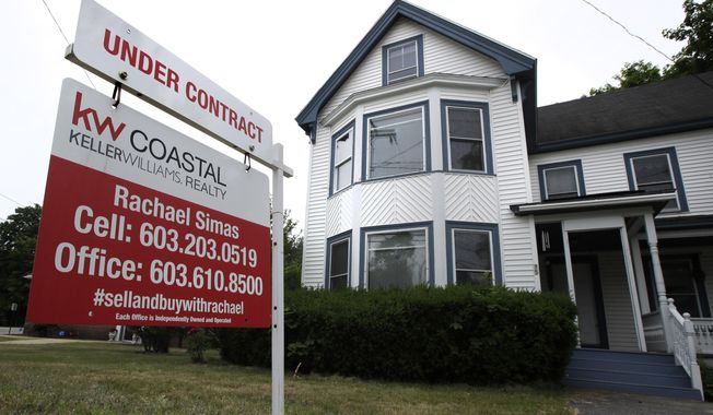 FILE - In this June 20, 2018, file photo, an &amp;quot;Under Contract&amp;quot; sign is displayed in front of home for sale in Raymond, N.H. The number of Americans signing contracts to buy homes rebounded a record 44.3% in May after a record-breaking decline the previous month, as the impact of the coronavirus pandemic sidelined both buyers and sellers. The National Association of Realtors said Monday, June 29, 2020, that its index of pending sales rose to 99.6 in May, the highest month-over-month gain in the index since its inception in January 2001.(AP Photo/Charles Krupa, File)