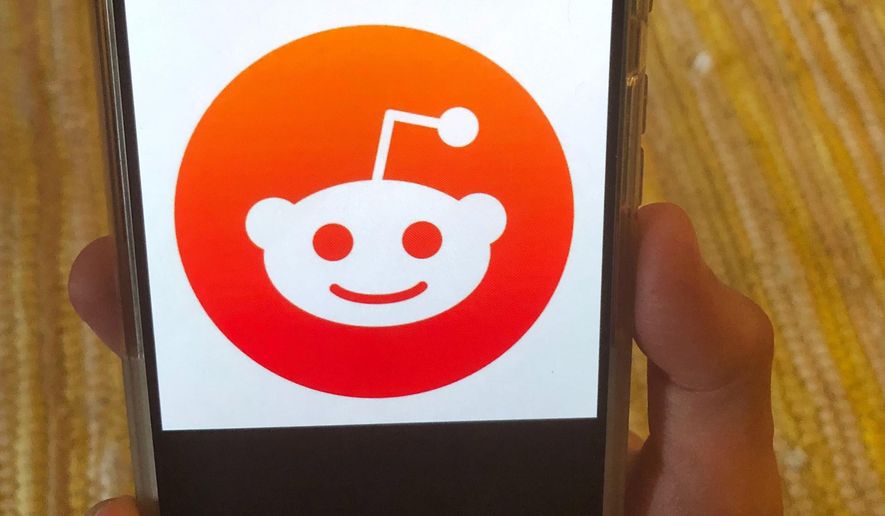 This Monday, June 29, 2020 photo shows the Reddit logo on a mobile device in New York. Reddit, an online comment forum that is one of the internet&#39;s most popular websites, on Monday, June 29, 2020 banned a pro-Donald Trump forum as part of a crackdown on hate speech. Reddit banned a total of 2,000 of these forums, or subreddits, most of which it said were inactive or had few users. (AP Photo/Tali Arbel)
