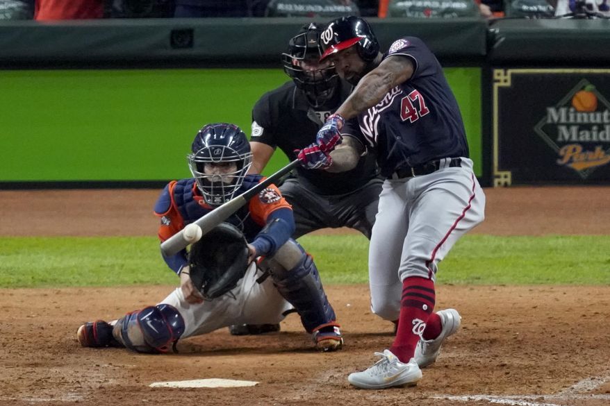 In this Oct. 30, 2019, file photo, Washington Nationals' Howie Kendrick hits a two-run home run against the Houston Astros during the seventh inning of Game 7 of the baseball World Series in Houston. The Astros were scheduled to spend July 4 in the nation's capital during a three-game series against the defending World Series champion Nationals. Houston won all three games at Nationals Park last October. But the Nationals won every game at Minute Maid Park, with Kendrick's two-run home run in the seventh inning of Game 7 putting them ahead to stay. (AP Photo/Eric Gay, File) **FILE**