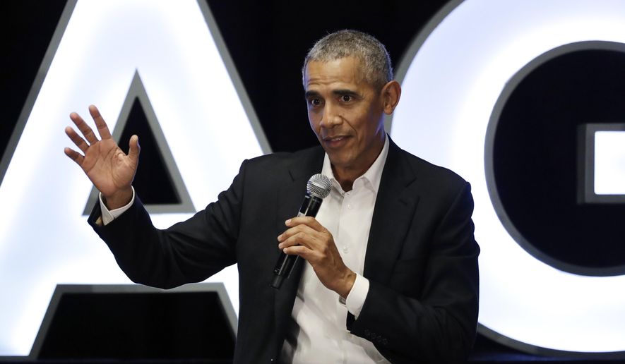 FILE - In this Feb. 15, 2020, file photo, former President Barack Obama talks during a panel with NBA players Chris Paul, Kevin Love and Giannis Antetokounmpo and sports analyst Michael Wilbon in Chicago. Obama tipped his cap. So did three other former presidents and a host of prominent civil rights leaders, entertainers and sports legends in a virtual salute to the 100-year anniversary of the founding of baseball’s Negro Leagues. The campaign launched Monday, June 29, 2020, with photos and videos from, among others, Hank Aaron, Rachel Robinson Derek Jeter, Colin Powell, Michael Jordan, Obama and presidents George W. Bush, Bill Clinton and Jimmy Carter at tippingyourcap.com. (AP Photo/Nam Y. Huh, File)